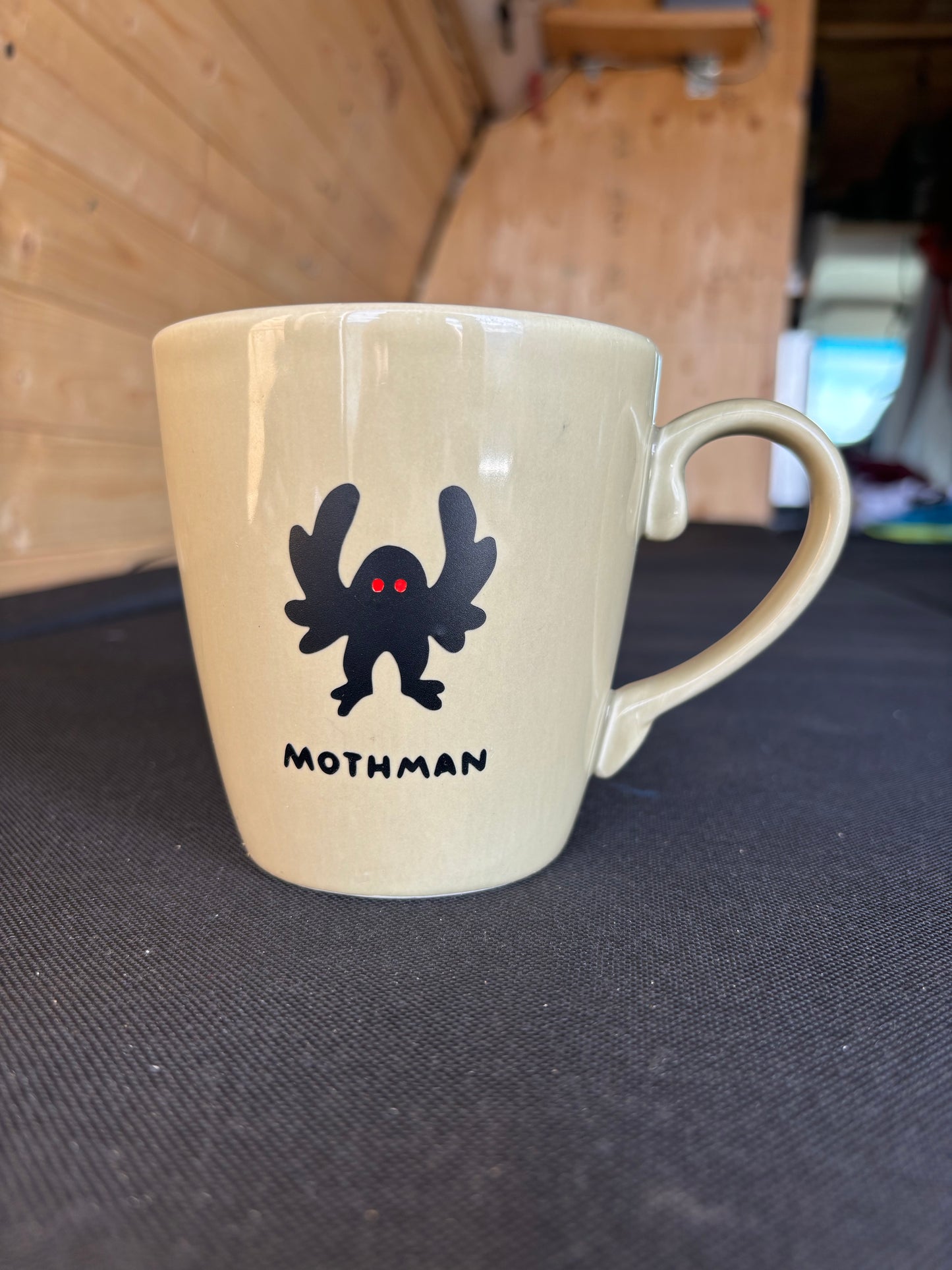 Mothman upcycled mug - red eyes - greenish