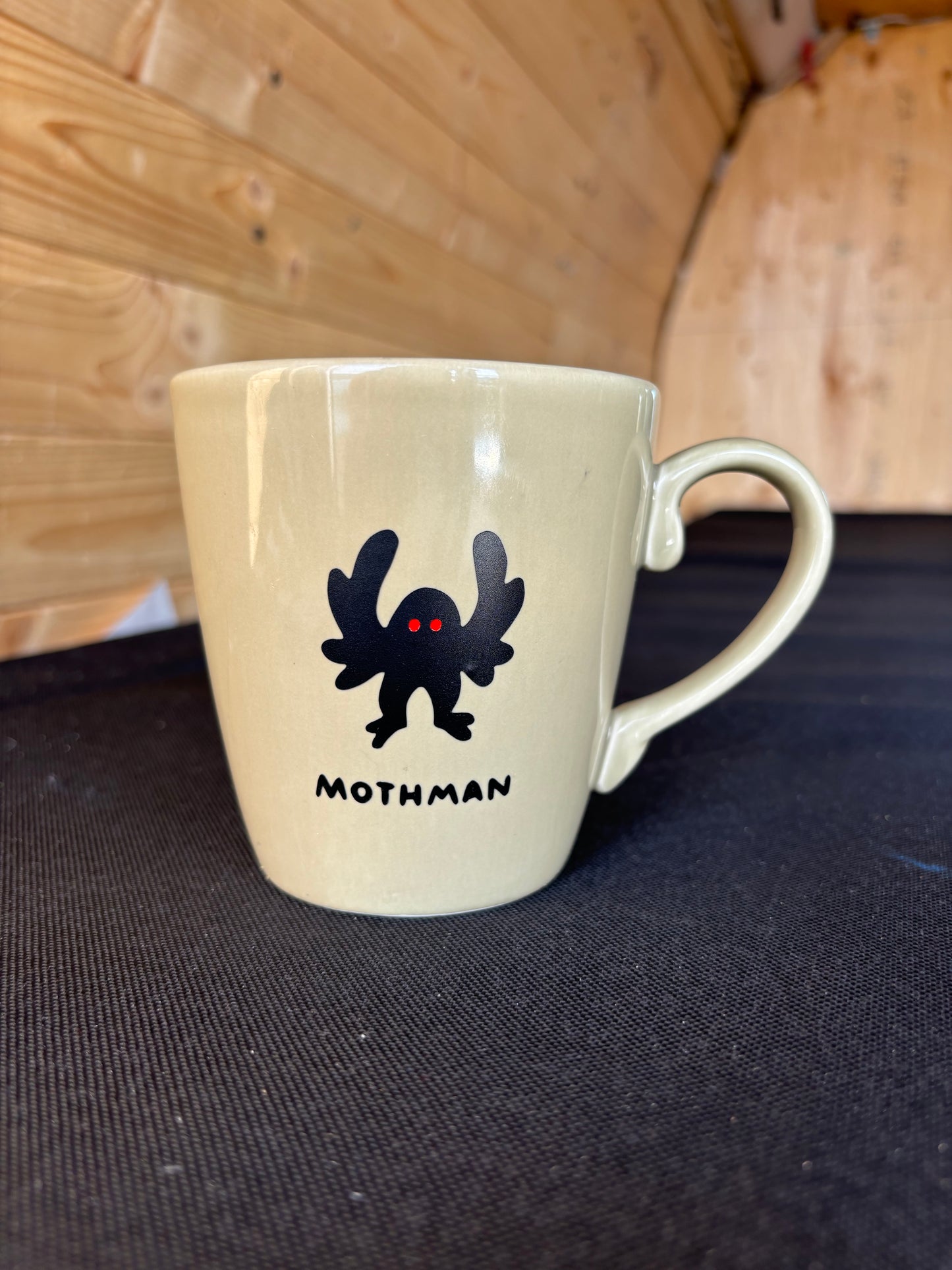 Mothman upcycled mug - red eyes - greenish