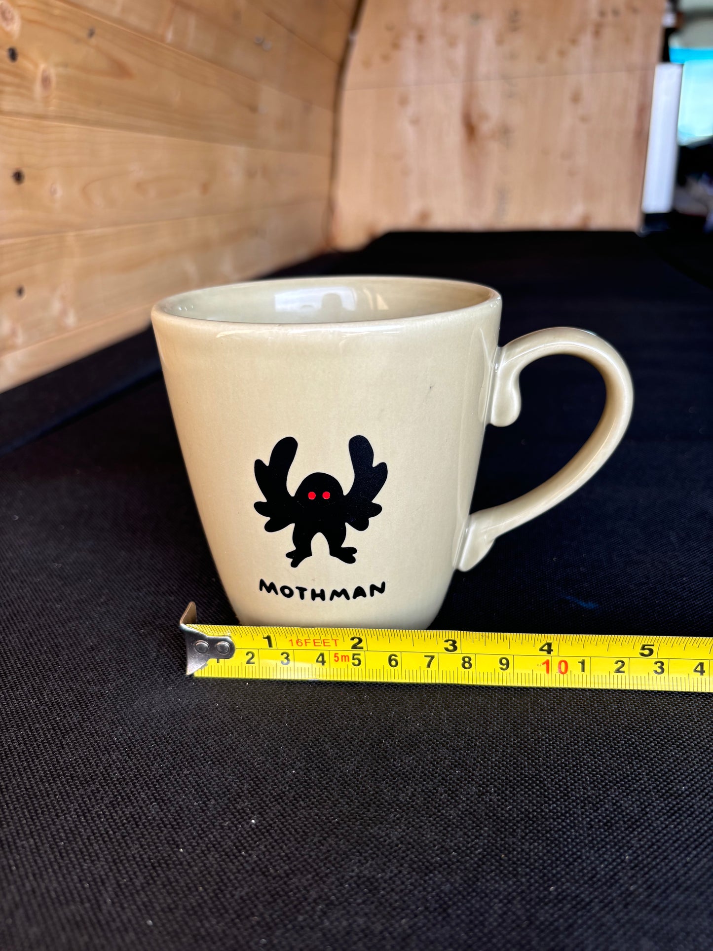 Mothman upcycled mug - red eyes - greenish