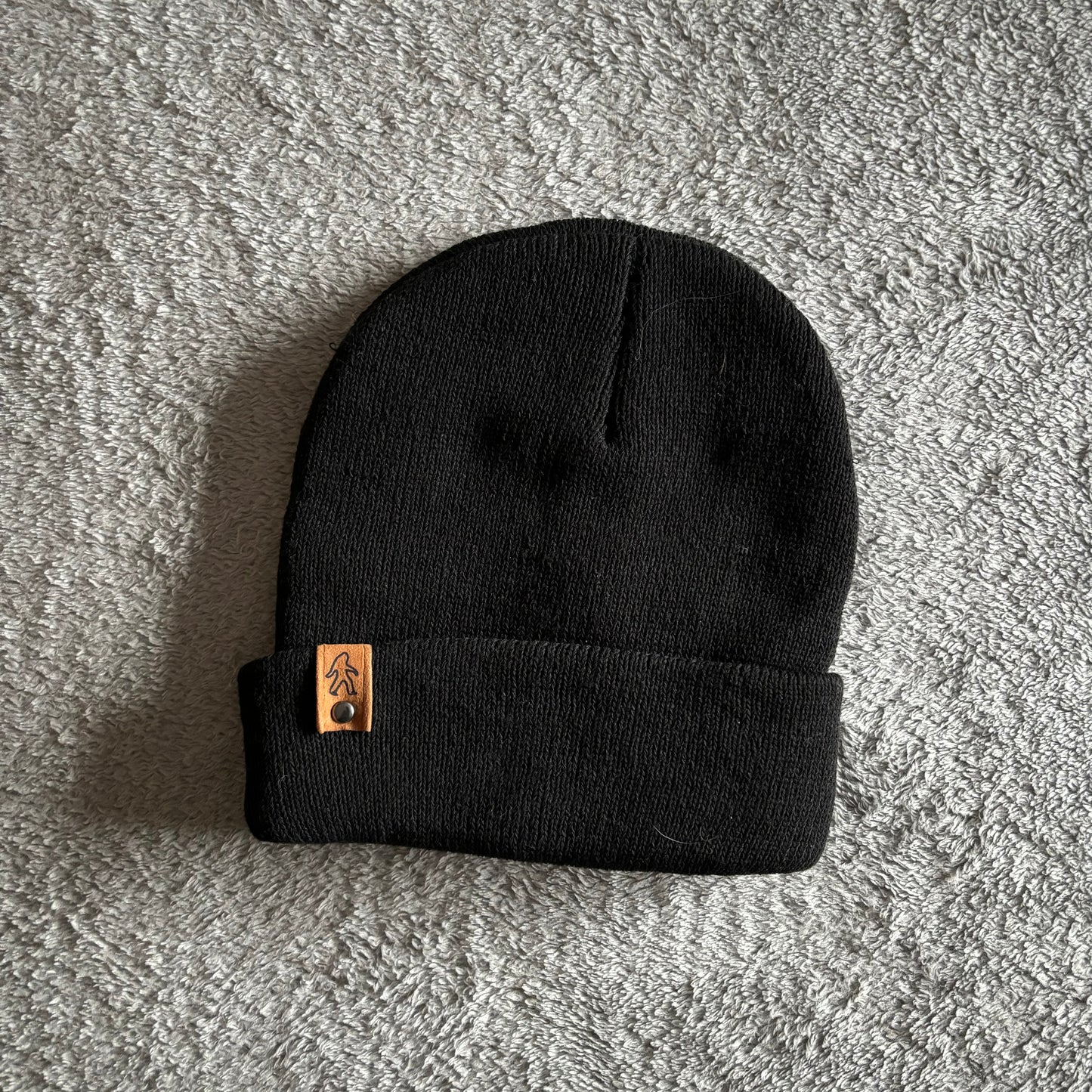 Black beanie with squatch tag